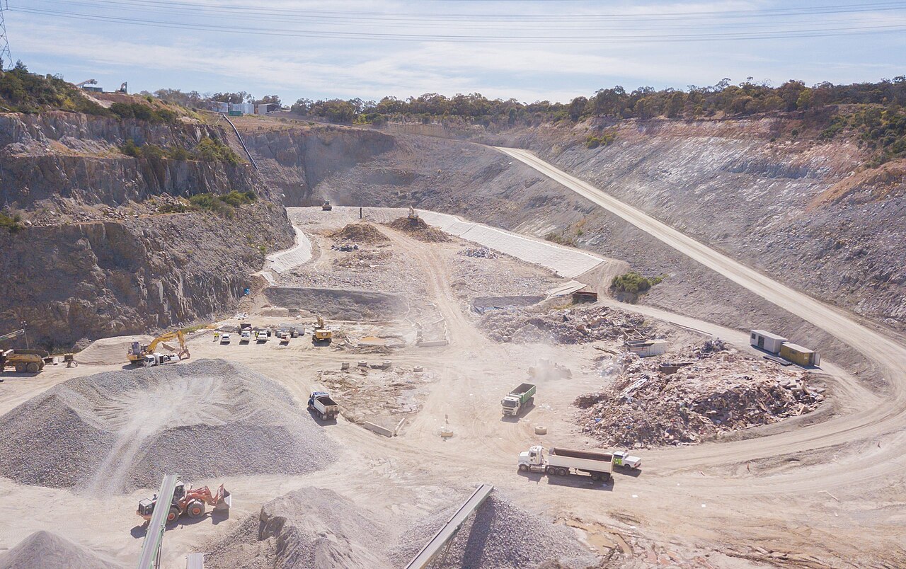 Aerial view of an active landfill and recovery site cut into a former quarry